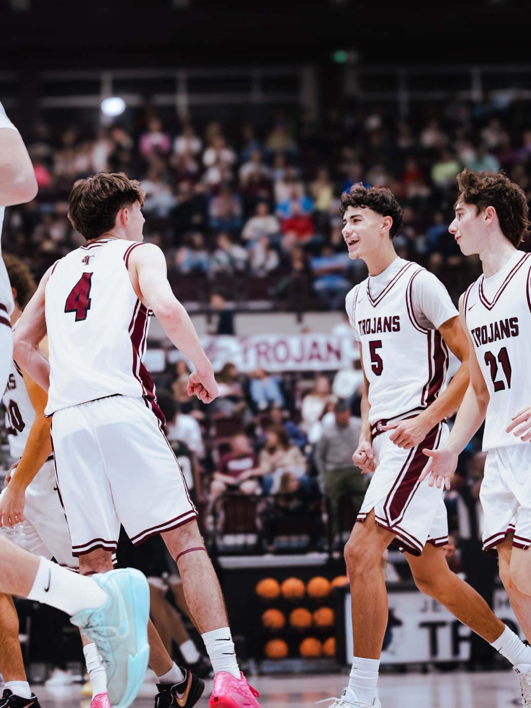 Aiden Bezenah celebrating with Jenks teammates
