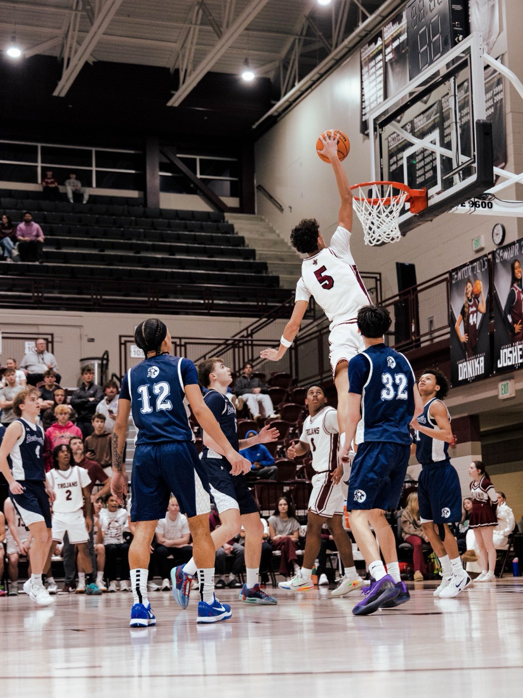 Aiden Bezenah dunking for Jenks High School
