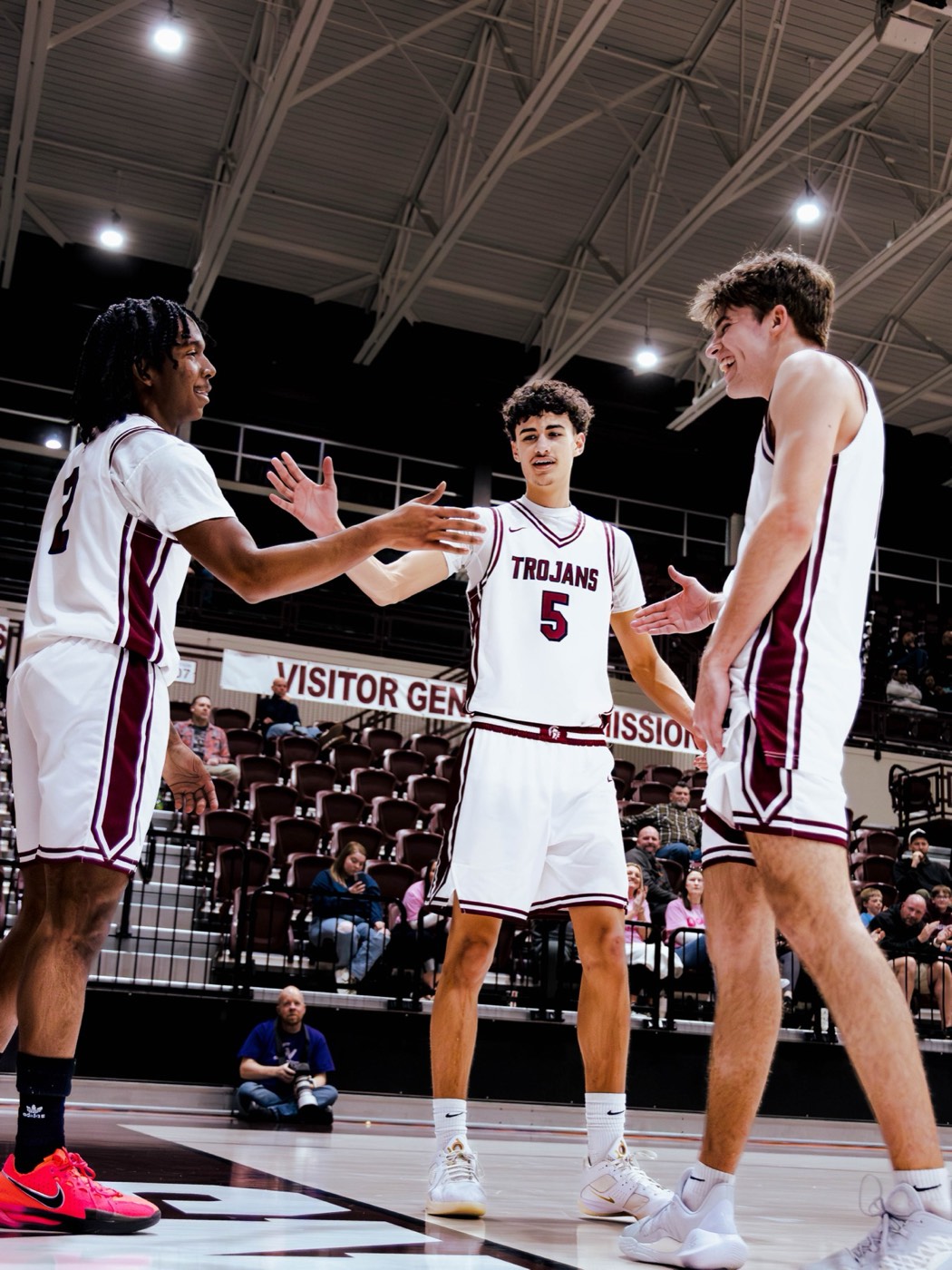 Aiden Bezenah with Jenks teammates before tipoff